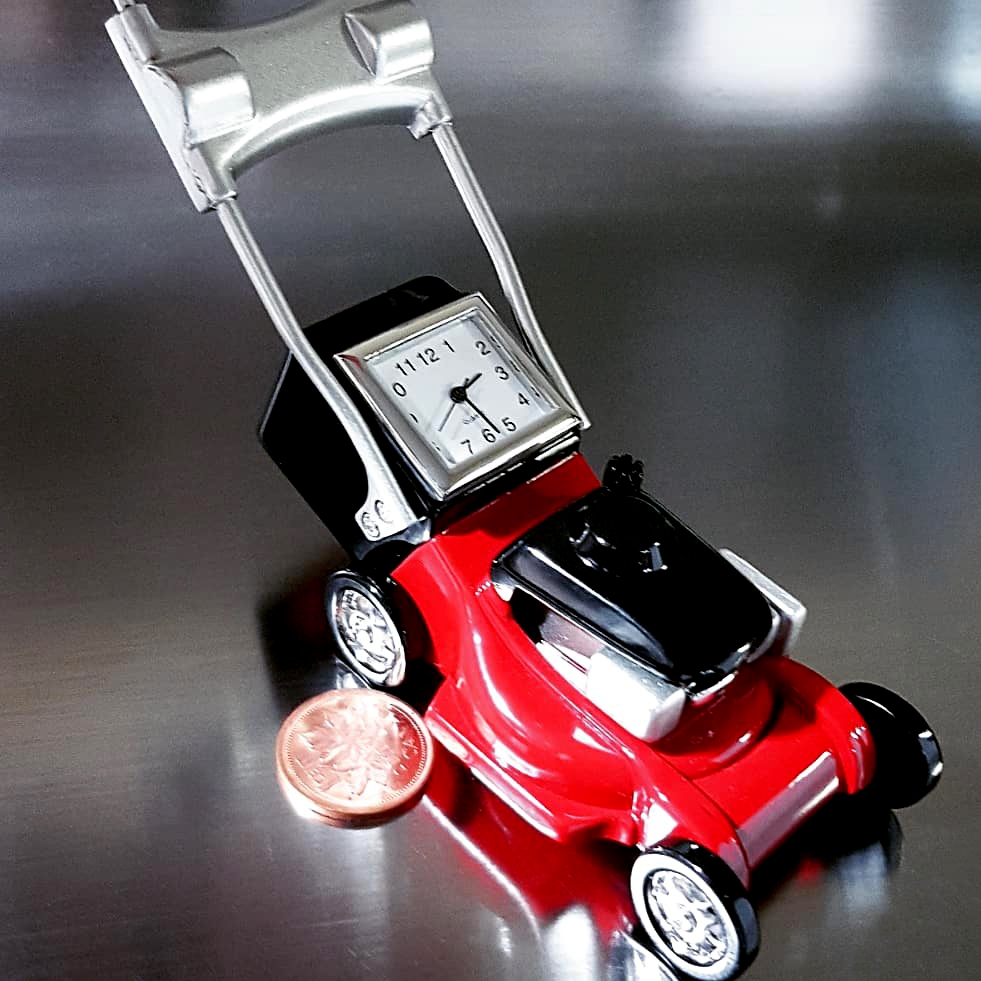 tiny toy lawn mower